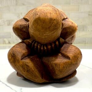 Small handmade wooden weeping man